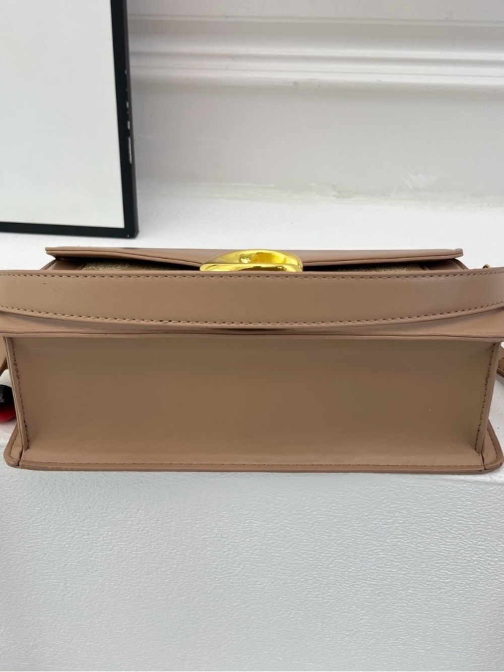 Elegant Beige Leather Crossbody Bag with Gold Hardware